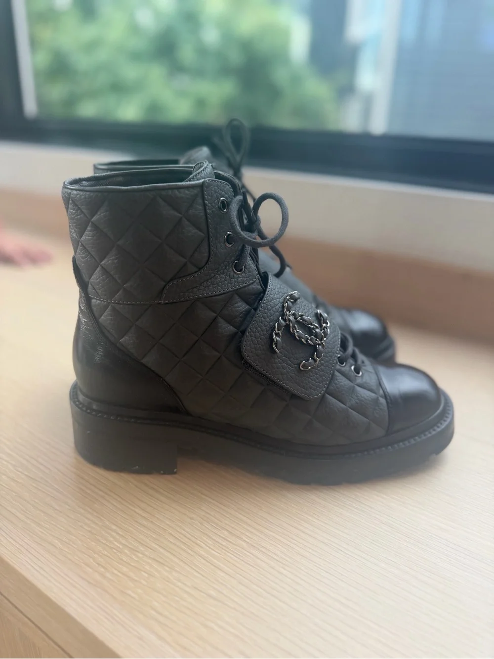 CHANEL Black Quilted Leather Combat Boots with Patent Toe